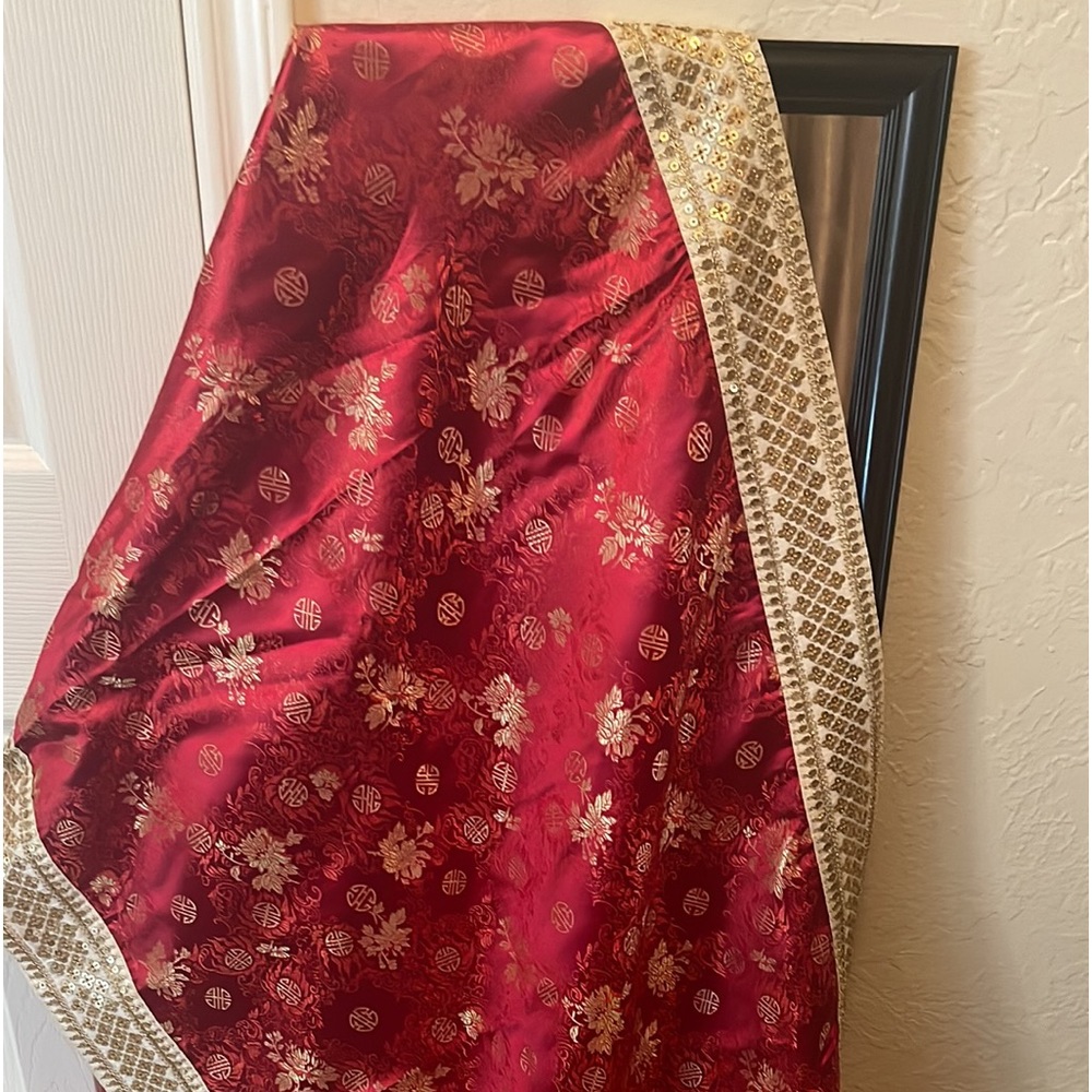 A brand new Indian banarsi silk shawl in red color.